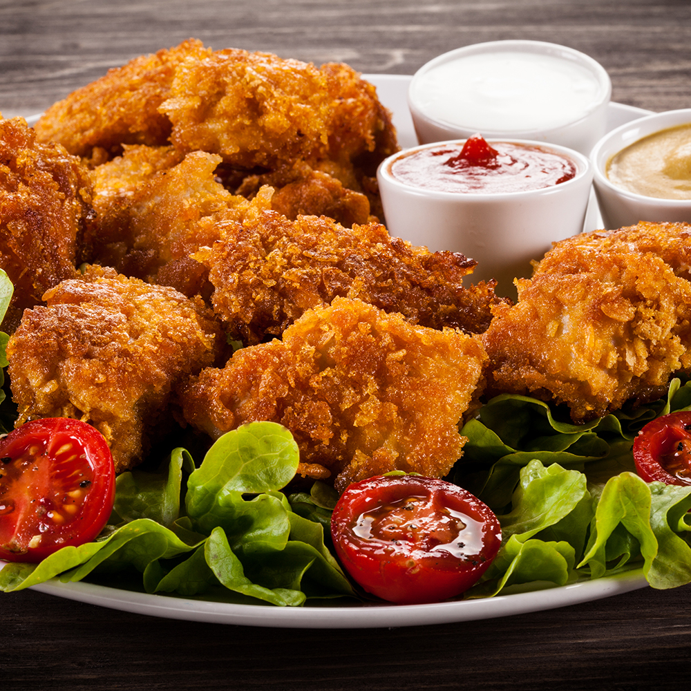 Homemade Chicken Tenders with Everything Bagel Seasoning Over Salad